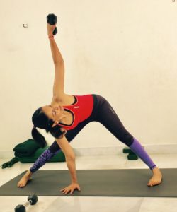 Wide angle side stretch with a dumbbell